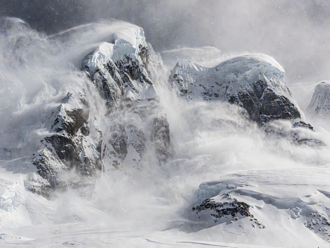Extreme Antarctic blizzard conditions with frozen mountain peaks